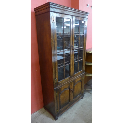 79 - A Titchmarsh & Goodwin style Ipswich oak four door bookcase