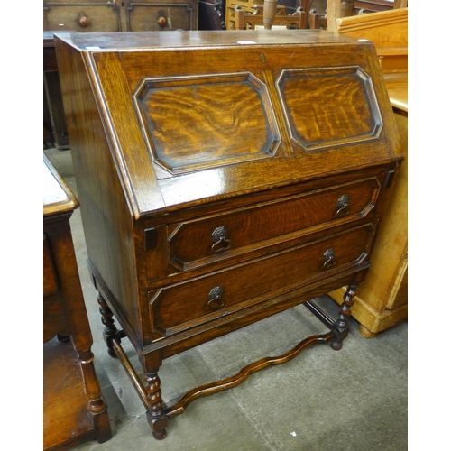 82 - An early 20th Century carved oak barleytwist bureau