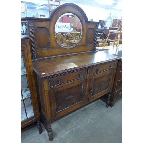 88 - An early 20th Century oak barleytwist mirrorback sideboard