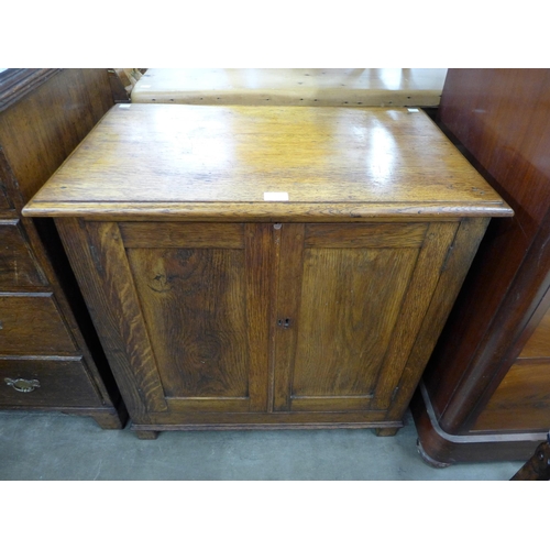 89A - An early 20th Century oak two door cupboard