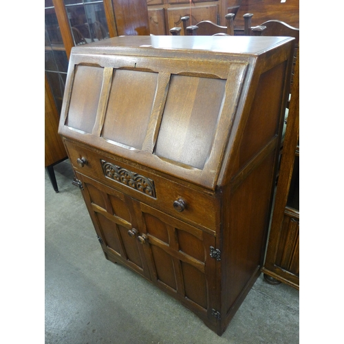 93 - A carved oak bureau