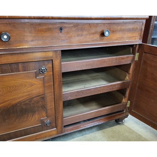 77 - A George IV Gillows style fitted mahogany press cupboard. With non-transferable Standard Ivory Exemp... 