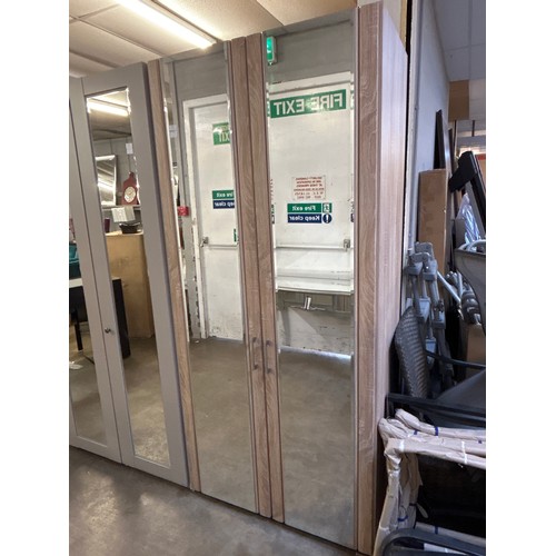 1501 - A wood effect double wardrobe with mirrored doors * This lot is subject to VAT