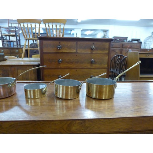 351 - Assorted small brass and copper coated saucepans