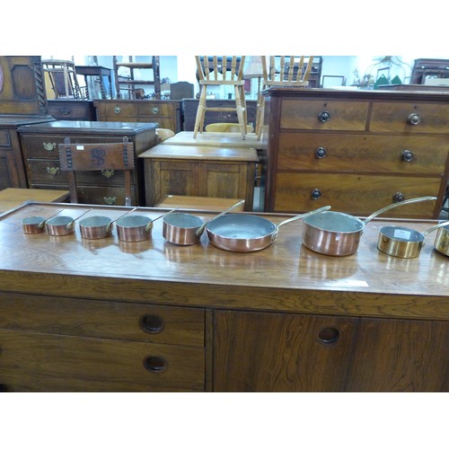 351 - Assorted small brass and copper coated saucepans