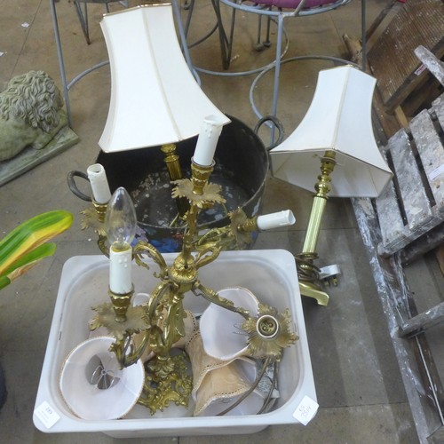 280 - A gilt Rococo style table lamp on an onyx base and a pair of brass table lamps