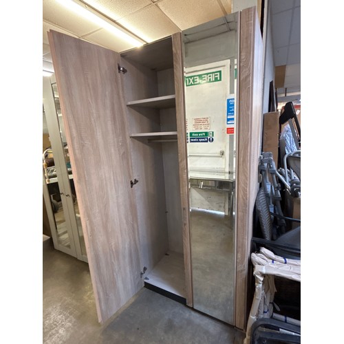 1501 - A wood effect double wardrobe with mirrored doors * This lot is subject to VAT