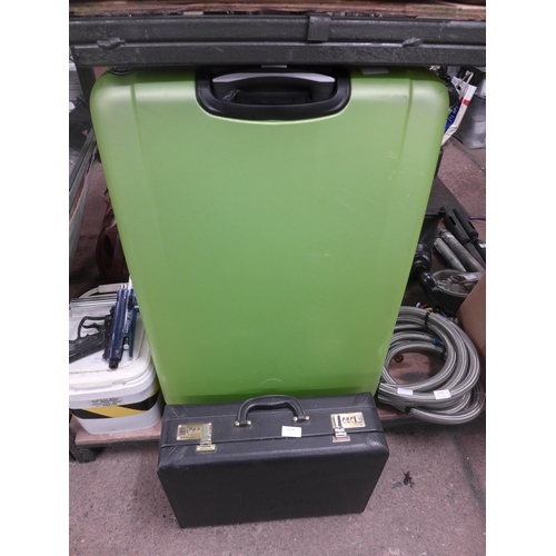 2538 - A large green plastic luggage case and a black leather briefcase with double combination lock