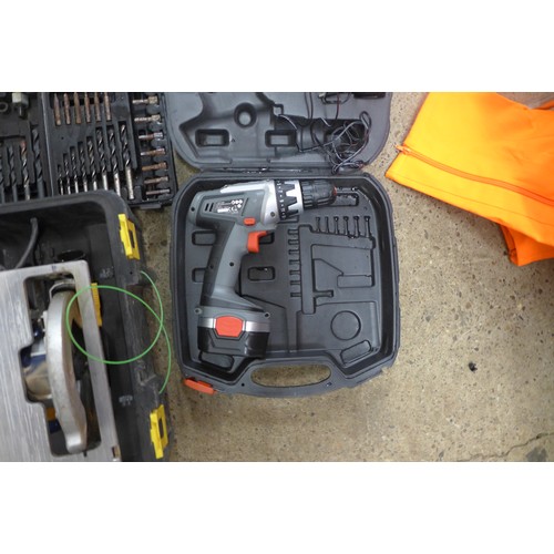 2008 - 5 Cased tools - two drills, power saw, electric screw driver and a cased drill bit set