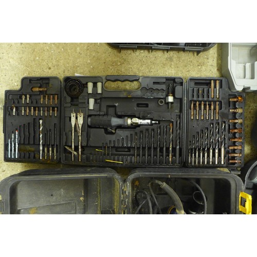 2008 - 5 Cased tools - two drills, power saw, electric screw driver and a cased drill bit set