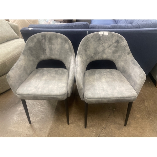 1471 - A pair of grey velvet upholstered dining chairs *This lot is subject to VAT