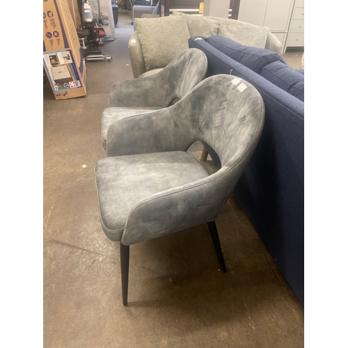 1471 - A pair of grey velvet upholstered dining chairs *This lot is subject to VAT