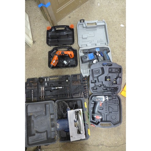 2008 - 5 Cased tools - two drills, power saw, electric screw driver and a cased drill bit set