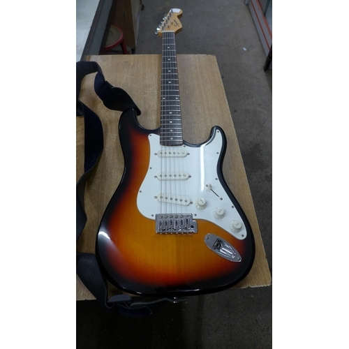 2140 - A Fender Squier Strat electric guitar in soft case