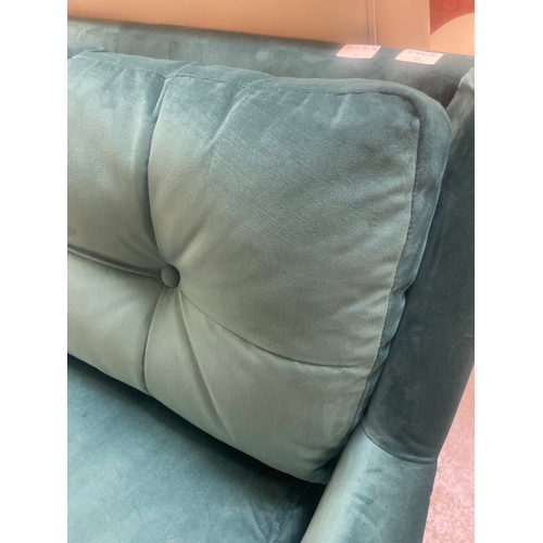 1319 - A turquoise velvet upholstered corner sofa