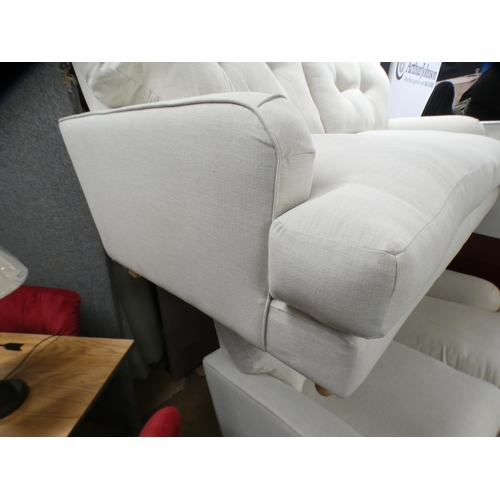 1410 - An ivory upholstered three and two seater sofa on turned legs RRP £1798