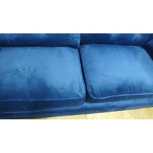 1420 - A Hoxton blue velvet upholstered three seater sofa RRP £799
