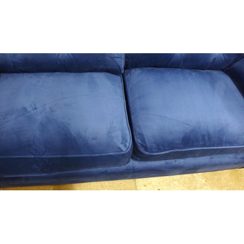 1422 - A Hoxton blue velvet upholstered three seater sofa RRP £799