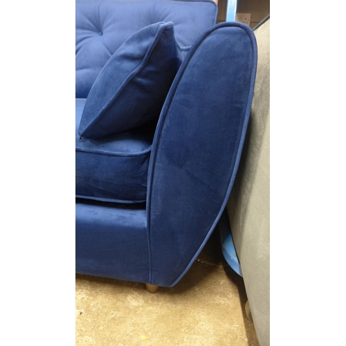 1423 - A Hoxton blue velvet upholstered three seater sofa RRP £799