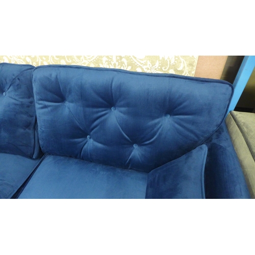 1423 - A Hoxton blue velvet upholstered three seater sofa RRP £799