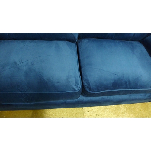 1429 - A Hoxton blue velvet upholstered three seater sofa RRP £799