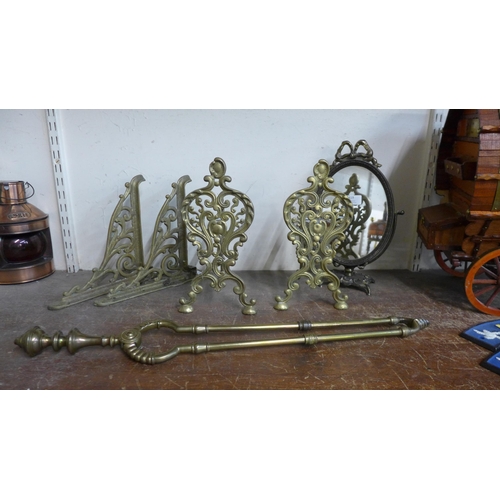 375 - A pair of Art Nouveau brass andirons, a toilet mirror and a pair of brackets