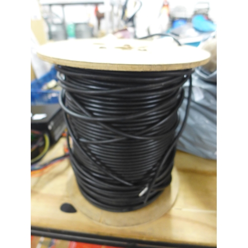 2311 - A large reel of black co-axial television cable (in excess of 40m)