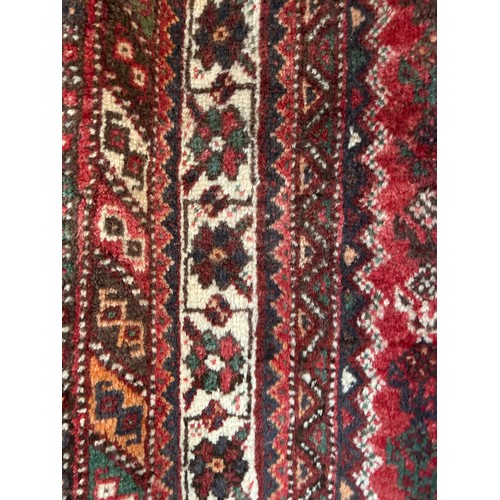 1515 - A fine hand woven, wool pile Persian Quashqai tribal carpet, 293 x 220cm