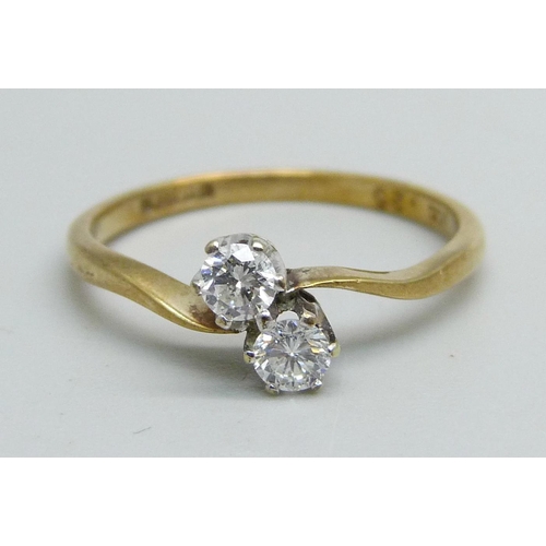 1048 - A 9ct gold, two stone diamond crossover ring, 1.4g, M