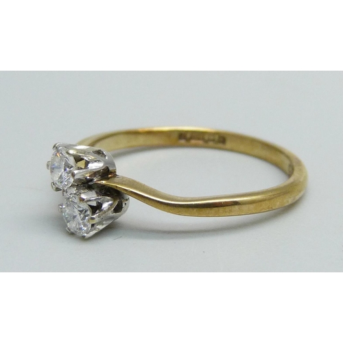 1048 - A 9ct gold, two stone diamond crossover ring, 1.4g, M