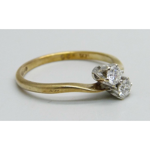 1048 - A 9ct gold, two stone diamond crossover ring, 1.4g, M