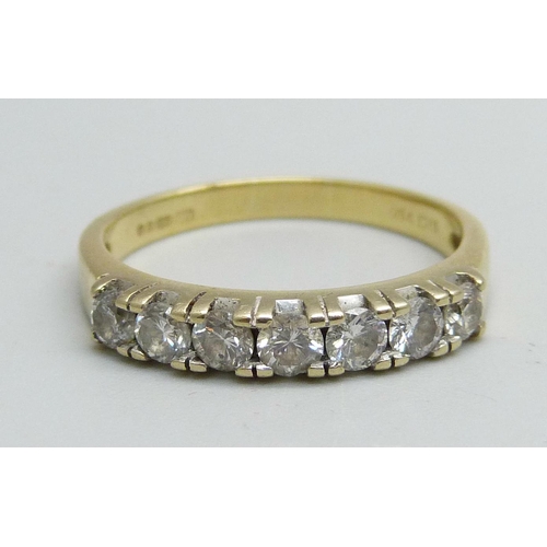 1056 - An 18ct gold, seven stone diamond ring, approximately 0.50ct diamond weight, 3.8g, Q