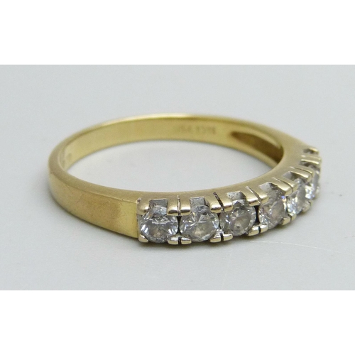 1056 - An 18ct gold, seven stone diamond ring, approximately 0.50ct diamond weight, 3.8g, Q