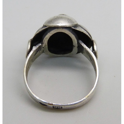 1057 - An Arts and Crafts silver ring, Polish marks on outer shank, J