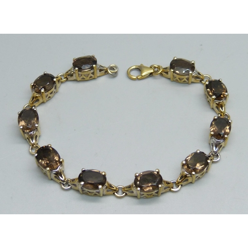 1059 - A silver gilt and smoky quartz bracelet