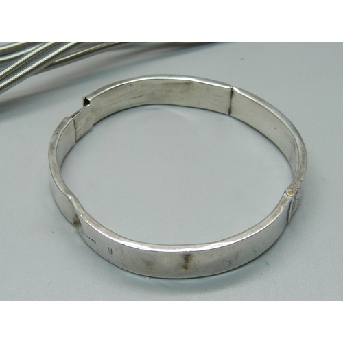 1060 - Two silver bangles, a/f, 29g, and a designer necklace