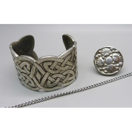 1062 - A St. Justin pewter necklace, a bangle and a ring