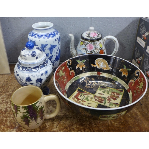 1086 - A box of Chinese and Japanese ceramics, decorative famille noir fruit bowl, a large pedestal dish, b... 