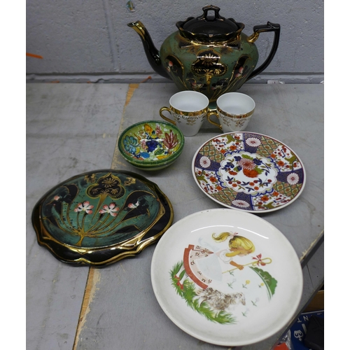 1098 - A Victorian black and green teapot and stand, two Egyptian themed plates, a pair of Argyle collector... 