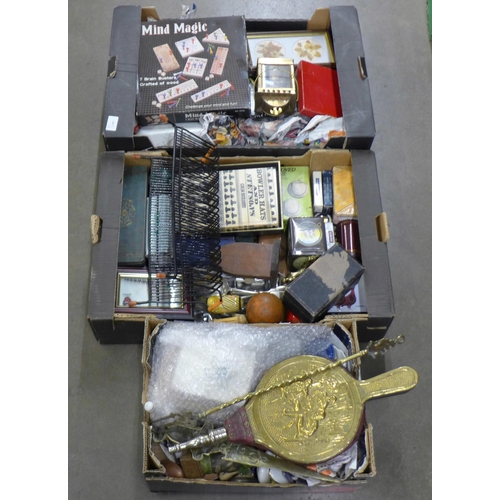 1102 - Three boxes of miscellaneous items, tins, Coronation china, plated cutlery, brass, tennis balls, etc... 