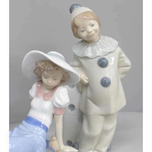 606 - Two Lladro figures and two Nao figures