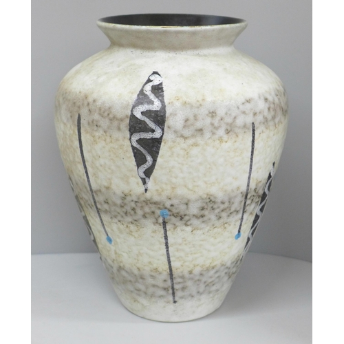 608 - A 1960s German vase with tribal design, 24cm