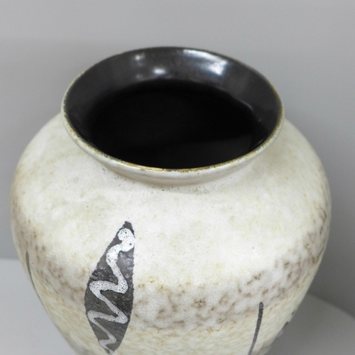 608 - A 1960s German vase with tribal design, 24cm