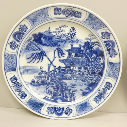 609 - Two Chinese export blue and white plates, 21cm