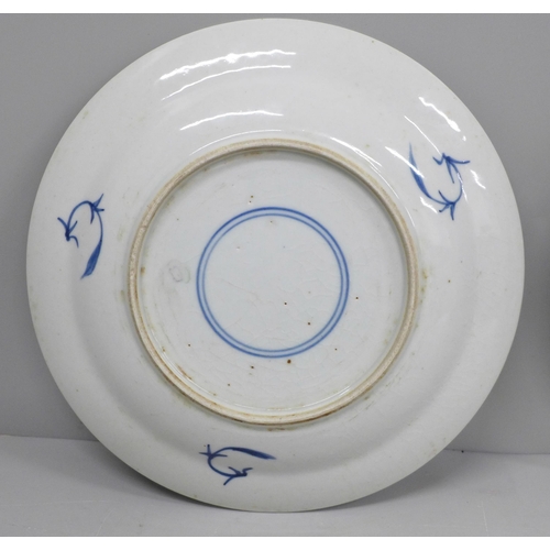 609 - Two Chinese export blue and white plates, 21cm