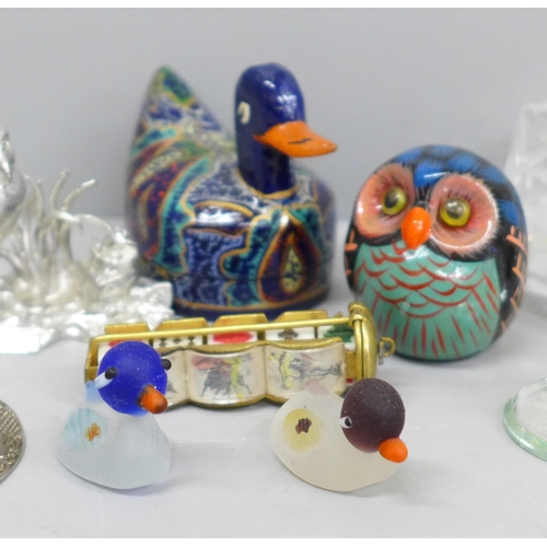 613 - Swarovski swans, jade coloured items, a tape measure, etc.