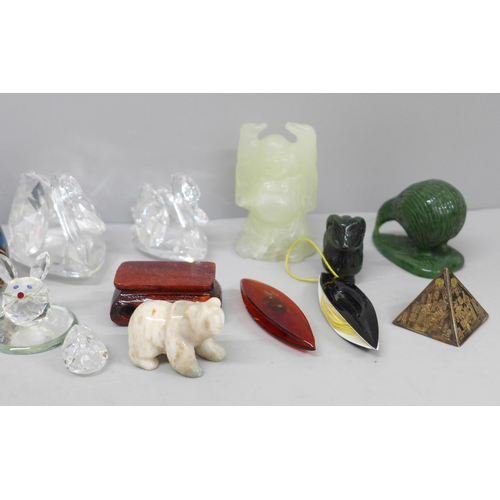 613 - Swarovski swans, jade coloured items, a tape measure, etc.