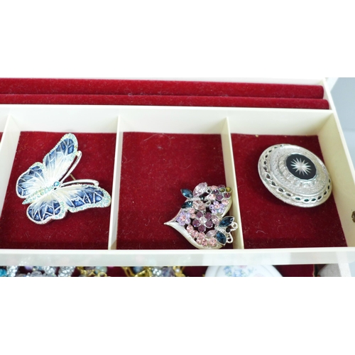 615 - A Swarovski swan and small scent, a crystal butterfly, a trinket pot and costume jewellery