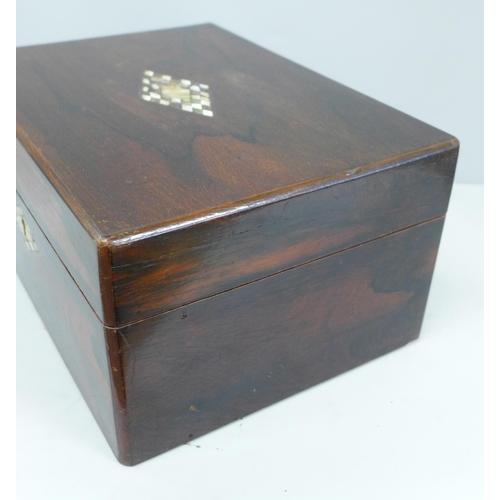 618 - A Victorian rosewood workbox with mother of pearl marquetry inlay