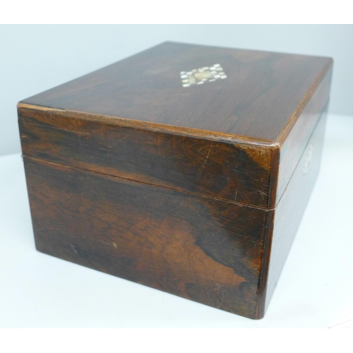 618 - A Victorian rosewood workbox with mother of pearl marquetry inlay